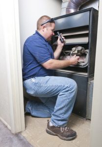 technician-working-on-furnace