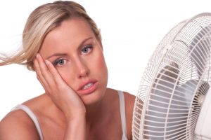 woman-in-front-of-fan-overheated