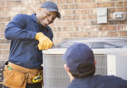 two-techs-working-on-outside-ac-unit