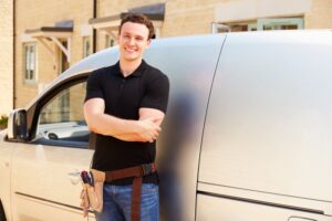 contractor-standing-in-front-of-van