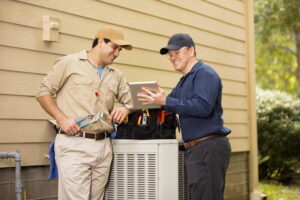 two-techs-working-on-air-conditioner